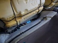 Cable ties hold HDMI cable (black and silver) to wire bundle