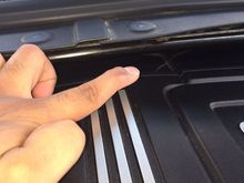 Pointing at one of the cracks