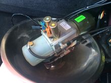 Pump of cradle still attached to hoses.