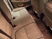 Left rear seat appears discolored in the photo; it is not.  I took this shot in the garage, and that's just fluorescent lighting coming in through the window.