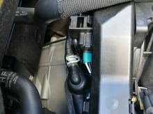 access from us passenger side of vehicle,
also move that grey hose clip in the center
out of the way or it will stab your arm
