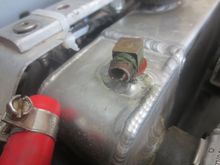 Broken fitting unscrewed from the 90 degree fitting. By the way, fibre washers are far better than copper in this application, IMO.