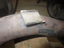 Bracket legs shortened at the pipe end