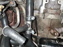 The left side valley hose connects to the metal-three way connector and the octopus hose. 