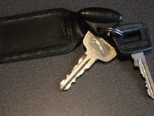 The Keys of my Pre-Facelift '1989' V12
The 'Black Key' does the Ignition.
The Silver Key does
The Doors -The Boot/Trunk - The Cubby Box and The Glove Compartment.
You only need the 'Dongle if you have an Immobilizer.