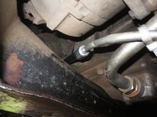 Hose emerging on the front RHS of the crossmember