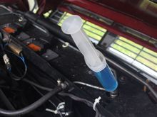 Putting in the last drop of Antifreeze with a Syringe but with the benefit of Hindsight, I should have done it through the Banjo on the other side. (Although of course there are other ways)