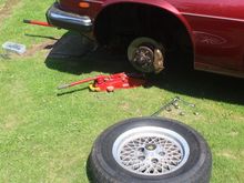 So much easier if you take the Wheel off.
The smaller Jack is to lower the suspension and then assist the Shock Absorber back into place.