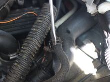 Once that Hose Clip has been undone and that Pipe VERY CAREFULLY pulled off Brake Fluid from the Reservoir will Flood out everywhere!