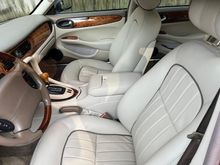 Seats, armrest, parking brake gaiter, third brake light cover redone in Connolly leather. 