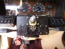 The ignition switch plugged in and dangling below. I have it secured through the instrument panel light dimmer switch hole with a cable tie.