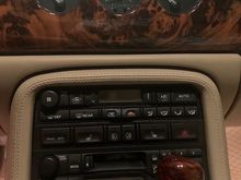 Replacement walnut burl shift knob and center panel.