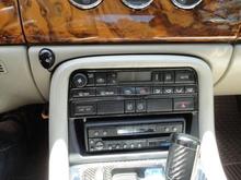 Stereo with screen stowed no trim plate (in progress).  Note graphite shifter.