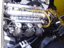 The motor of the yellow XKE.  The car had 4 point racing harnesses in it.  I bet it can move.