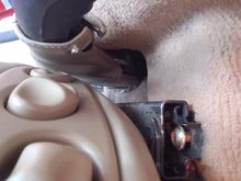 Although it looks accessible, the front seat screw is blocked by the rail overhead, 