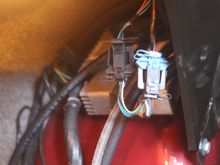 The Speedo Interface 'Black Box' is inside the Boot/Trunk underneath the Fender/Wing
I couldn't get the Camera far enough in there to get a Photo but if you follow the thick wire from the Transducer in the IRS you should eventually find it though it isn't one of those things in the Photo, its further back than that