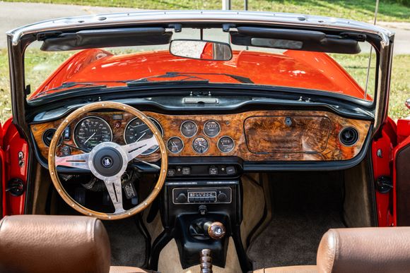 This was the interior of my 73 Triumph.  People used to joke with me that it was a little Jaguar-ish with the leather seat covers, Burled walnut dash, door caps, and matching wood rimmed wheel!