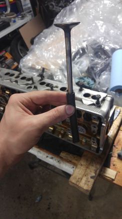 Patented Valve Lapping Adaptor - 1/4ID fuel line attached to a drill, With a gentle tapping motion as it spins.