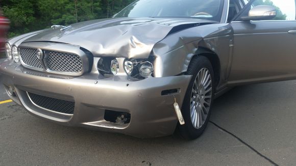 After hitting a small deer at sub-highway speed, after applying my brakes and swerving. Does this look like $18,000 of damage? Note the fully intact bumper.
