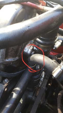 So,,, at the top is the boot that vents the crankcase on the front of bank B... The breather... Bottom right is the coolant cross pipe crossing over and the hose on a spigot on the top O the pipe that goes over and down to the coolant reservoir... Must be a "special" hose here?