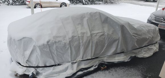 My wife was kind enough to step outside and take this. That's the car pocket in use. You can see the battery maintainer at the bottom. These things are huge so I tucked in the sides and used 8 foot bungees. 