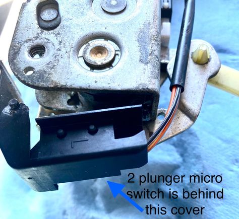 2 plunger microswitch is behind this cover.