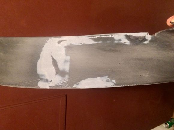 JB Weld is perfect for this material.