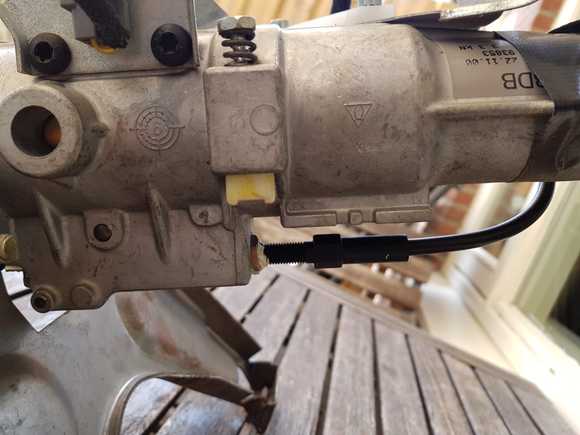 Cable close-up. This controls the forward/backward motion of the steering wheel.