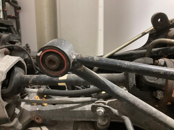 The bolts that go through the orange colored (rust) bushings and into the body could’ve been accidentally left loose while replacing the rear shocks and upper mounts. Basically what he’s touched needs to be double checked to make sure all the fasteners are tight. I’ve made that mistake before when I’m in a hurry. 