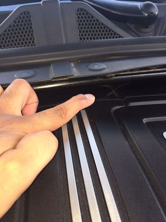 Pointing at one of the cracks