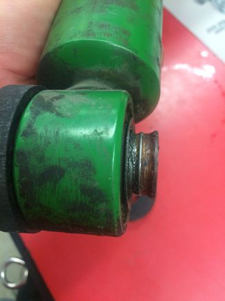 This is the rear shock after cleaning out the old dust boot and spring retainers. The new pieces I made will seal against the inside bush groove and will flex with the shock pivot.