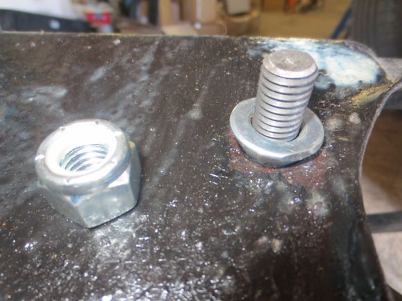 1/2 inch UNC studs into the diff, loctited in. taper washers and nylocs