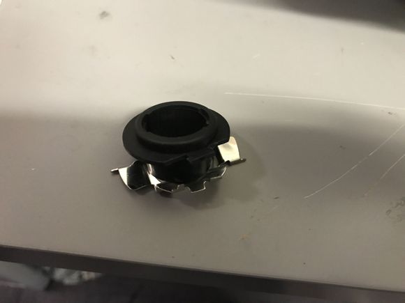 Metal Adaptor fitted over plastic LED barrel socket for fitting into the high beam housing.