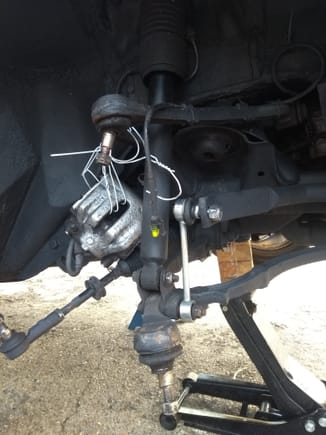 Brake caliper tied up out of the way