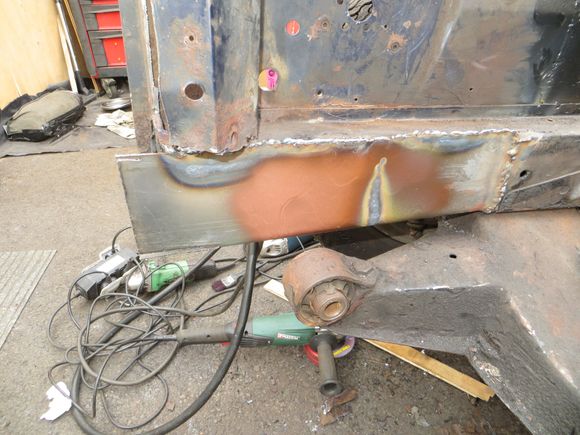 Because it was so hard to form the u-shaped channel on the other side, I boxed clever and just welded in the side and bottom. THe top side was unrusted. The brown stuff is weld through primer.