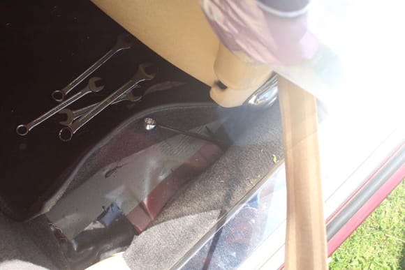 Location of Handbrake Adjustment Rod behind the drivers seat very close to the sill where that Spanner is sticking up
