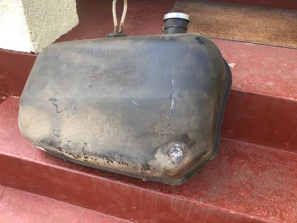 Right side fuel tank with damage where grit from road wheel had caused corrosion and a hole.