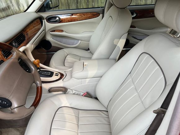 Seats, armrest, parking brake gaiter, third brake light cover redone in Connolly leather. 