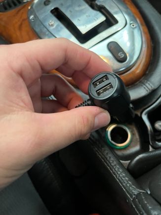 The Essgoo power wire heads straight into a 12-V cigarette lighter outlet and includes two USB ports for phone charging. I'm considering tapping it directly into the car's wiring if I find this annoying. 
