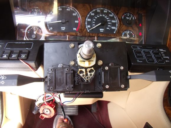 The ignition switch plugged in and dangling below. I have it secured through the instrument panel light dimmer switch hole with a cable tie.