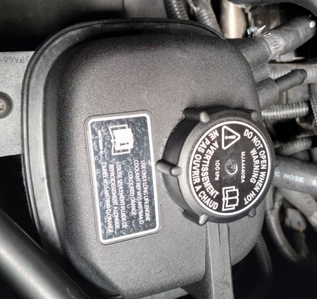 Coolant reservoir missing hose or not.