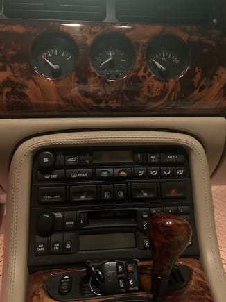 Replacement walnut burl shift knob and center panel.