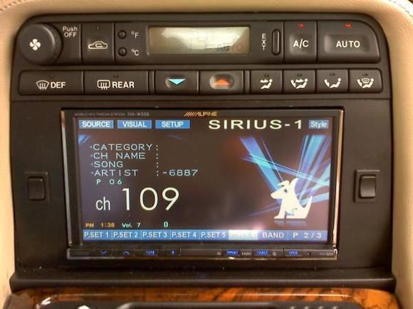 Double din solution with AM/FM, Sirius, iPod, movies, DVD, CD
Nav and Bluetooth phone.  Note small switches on either side of screen are seat heaters.