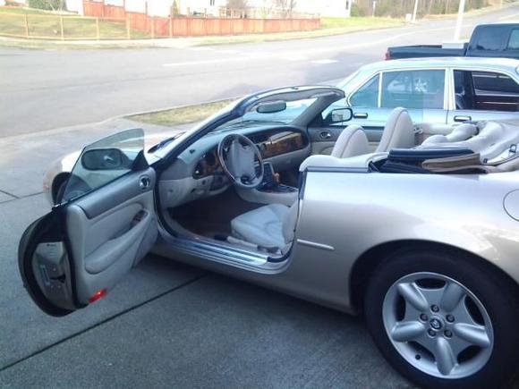 My new ride, 1999 XK8. The XJ6 in the back groud I gave to my daughter, it's her new ride.
