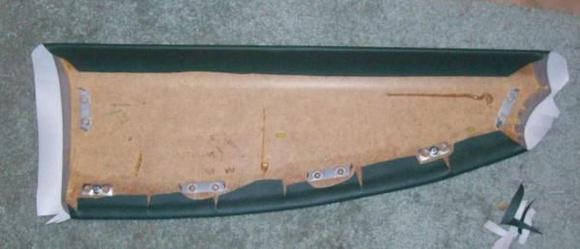 Lower portion of top piece stretched and glued in place