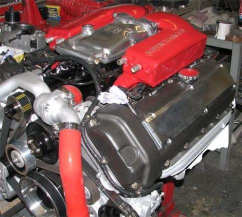 This is a 4.0ltr Nikasil engine has been stroked to a 4.2, larger bottom pulley, smaller top pulley and a sleeved idler to take up the belt slack, port and polished heads, aluminium coil pack covers. Larger independant supercharger cooling system, filled with glycol with uprated pump, 3" thick radiator with the gearbox cooling system removed and run through a seperate oil cooler, uprated fan assembly