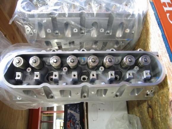 both fully assembled heads with titanium valves, retainers, keepers and Chevrolet racing valving springs.