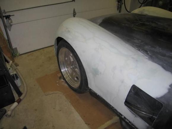 Finally, the left front fender starts to appear out of the bondo dust as I learn how to become a sculptor!!