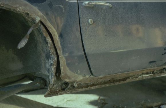 Plaster knocked out, cutting away rusty bits