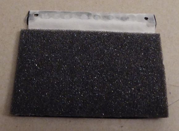 Vent flap inside side showing foam.
